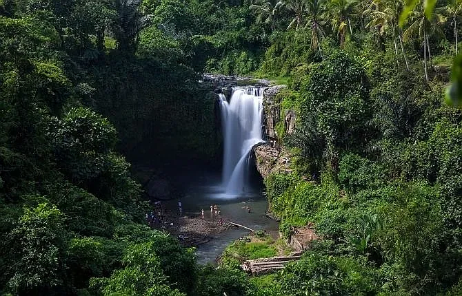 Swimming at Tegenungan Waterfall, Bali